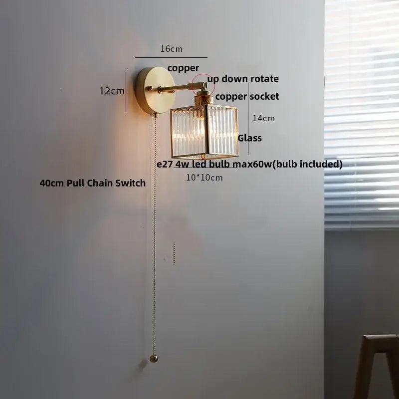 Copper wall lamp with clear ribbed glass rectangular shade and pull chain switch for vintage bathroom use