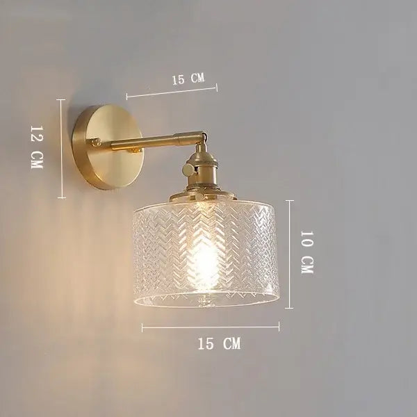 Vintage brass clear glass wall light with ribbed chevron textured shade by decorbites for elegant bedroom lighting