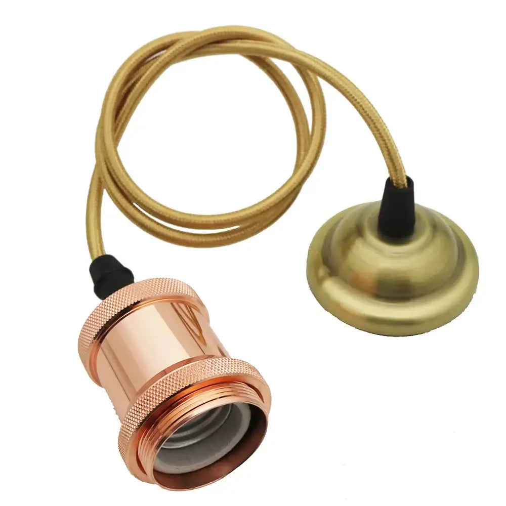 Copper-finished aluminum pendant light socket with ridged design and brass cap on gold cord for vintage decorbites dining use