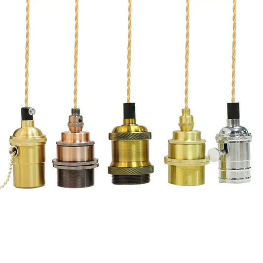 Vintage brass and copper cord pendant light pull chains with textured metal bodies and twisted gold cords for kitchen
