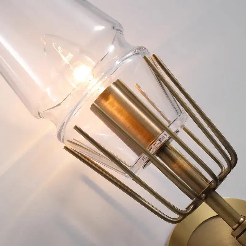 A brass crystal chandelier light with an industrial brass finish and clear glass shade for vintage dining room decorbites decor