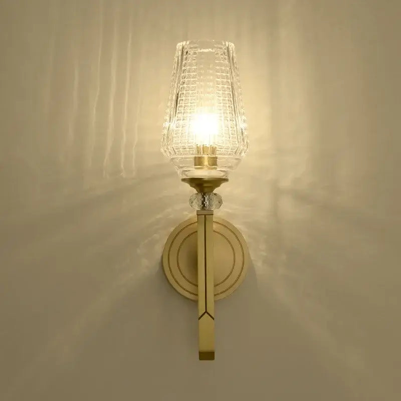 Vintage brass crystal copper wall lamp with clear textured glass shade and gold-toned metal frame for bedroom decorbites wall lamp