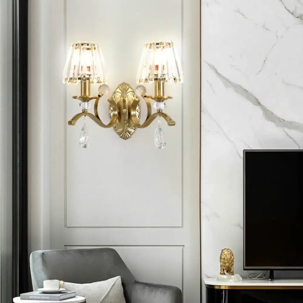 Vintage brass crystal fringe wall sconce with gold-toned fixture, two e14 bulb base lights, and crystal teardrop accents