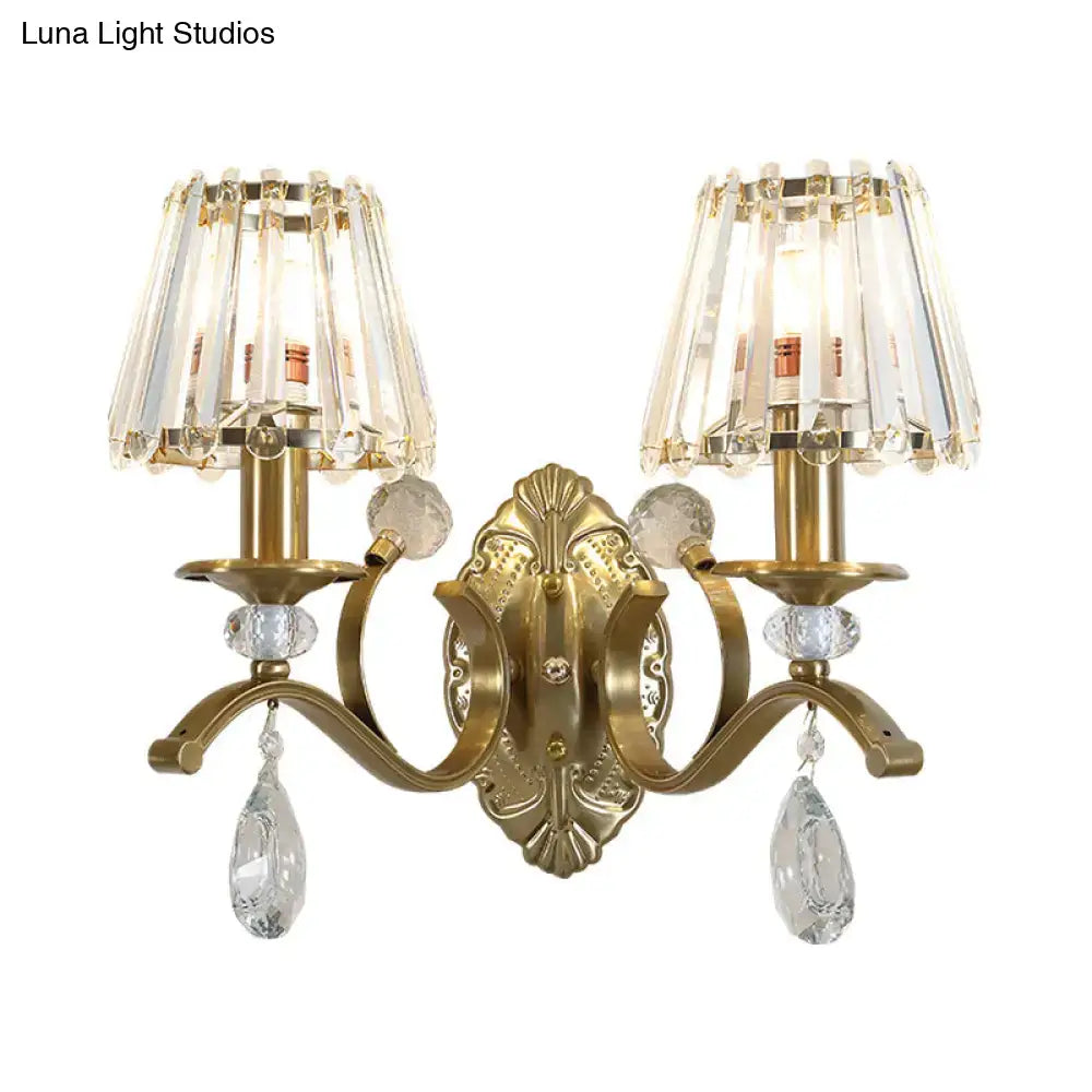 Vintage brass crystal fringe wall sconce with gold-toned finish, two chandelier-style shades, and e14 bulb base light type