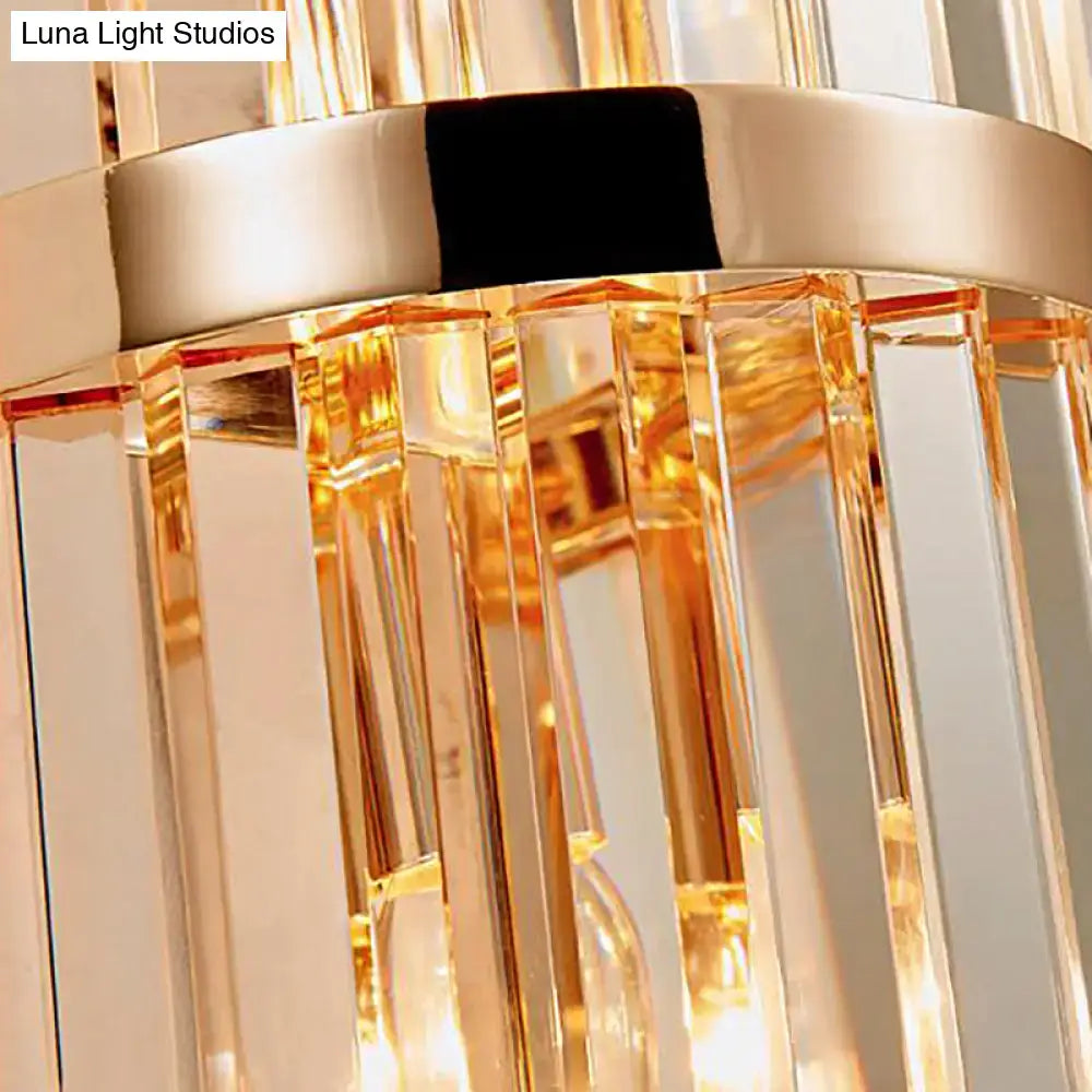 Vintage brass crystal wall lamp with gold-toned vertical prismatic glass rods and polished metallic band for living room