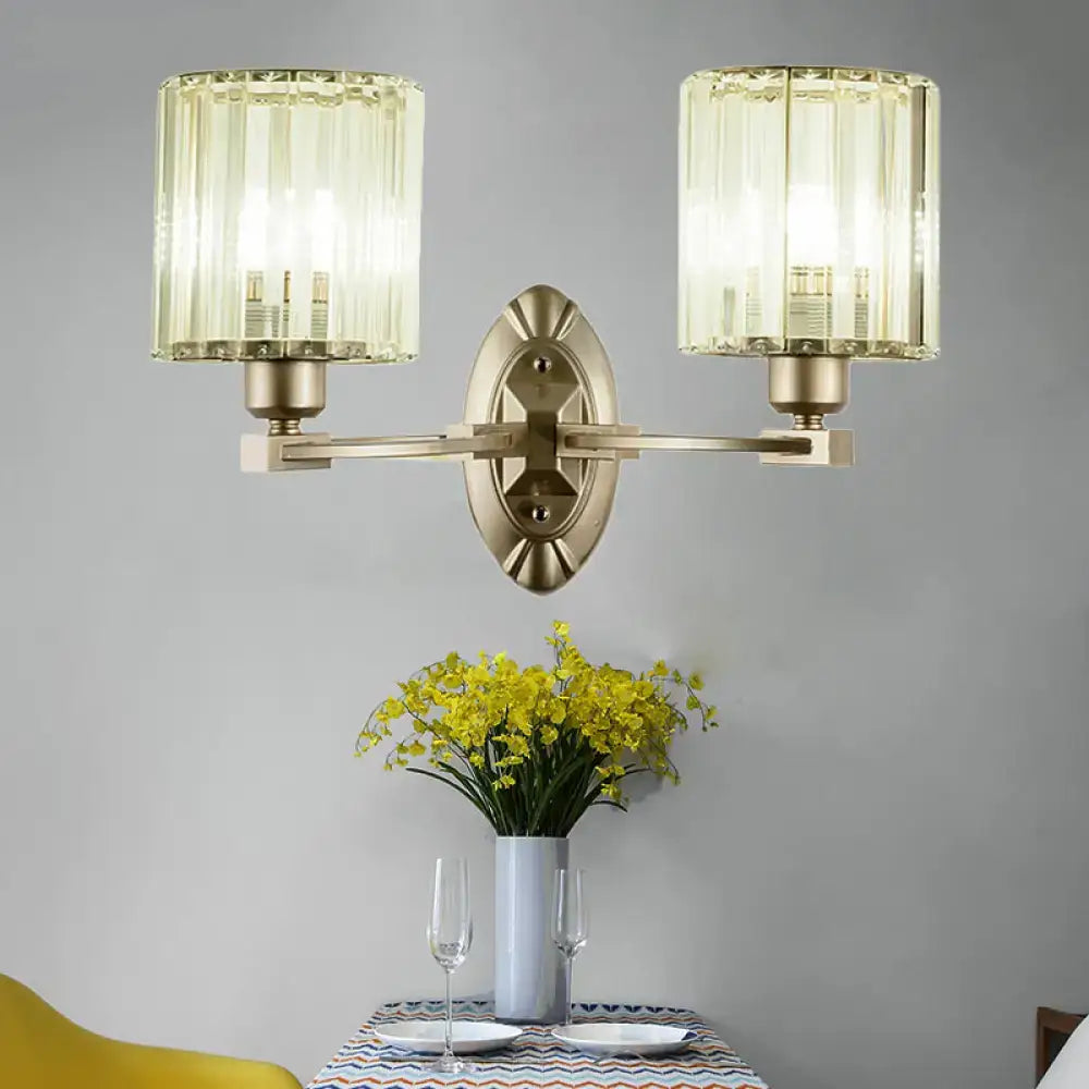 Vintage brass wall light fixture with two cylindrical ribbed glass shades for living room use