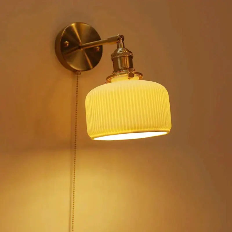 Warm yellow ribbed glass lampshade decorbites ceramic sconce lamp with adjustable brass arm and pull-chain switch for reading