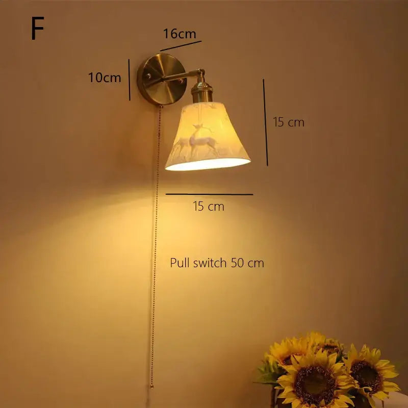Brass-finished decorbites ceramic sconce lamp with frosted glass deer shade and pull-chain for bedroom reading light