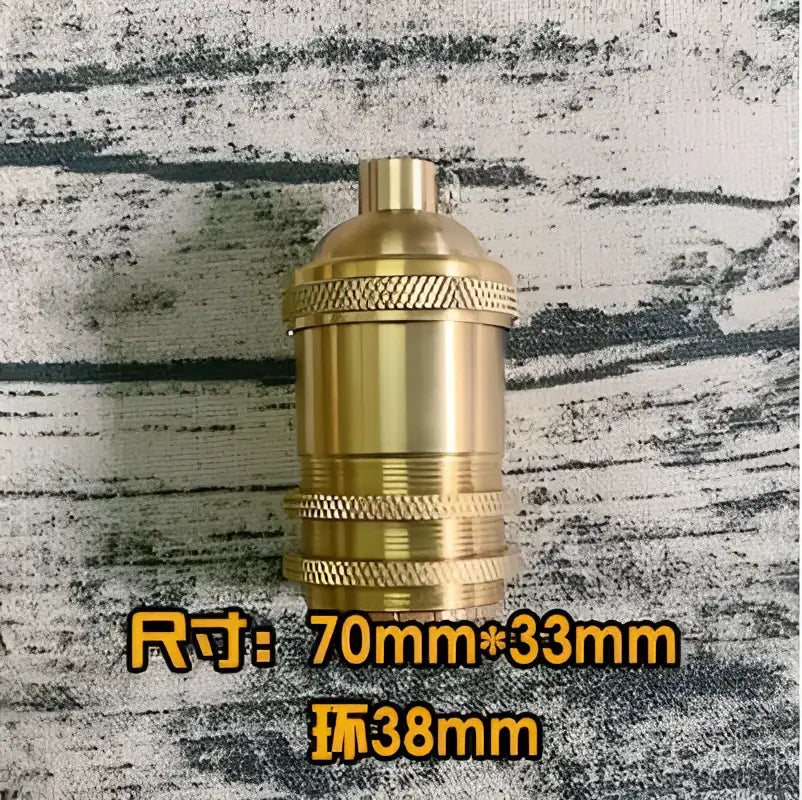 Vintage brass e27 lamp holder with textured ridged bands and a threaded top for living room use