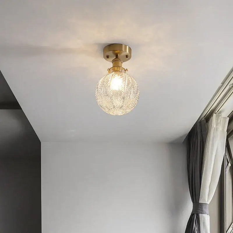 Vintage brass etched glass led ceiling light with a clear textured glass globe for living room ceiling light use