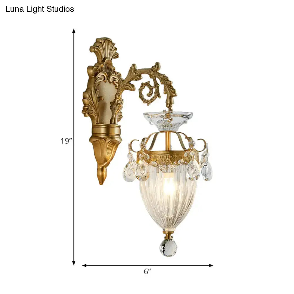 Vintage brass wall lamp with gold finish fluted glass shade and dangling clear crystals, approximately 12 inches high