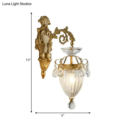 Vintage brass wall lamp with gold finish fluted glass shade and dangling clear crystals, approximately 12 inches high