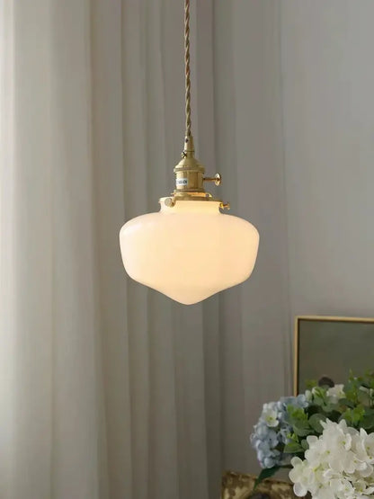 Vintage brass pendant lamp with off-white frosted glass shade led suspended by twisted cord for kitchen use