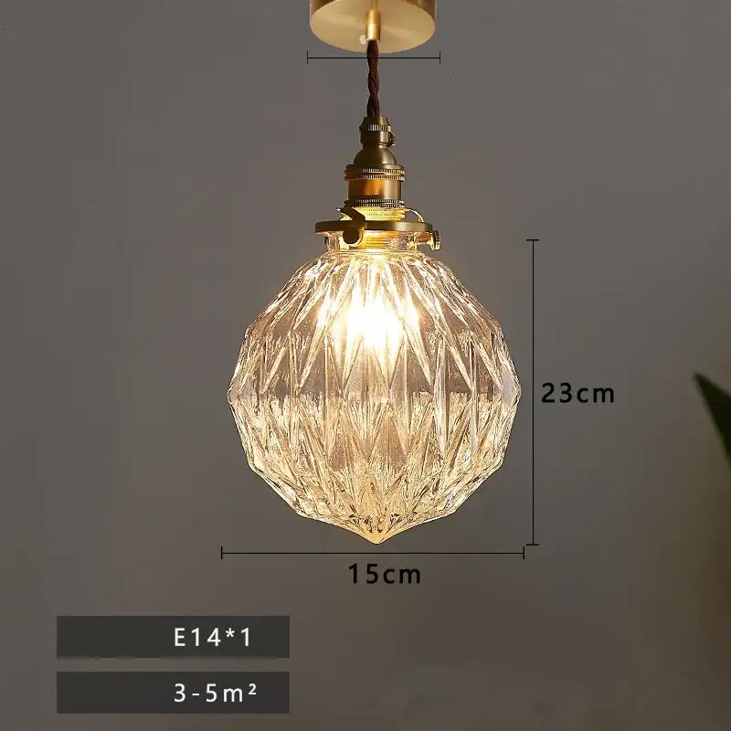 Vintage brass glass led pendant lamp featuring a warm glowing faceted shade and e14 bulb base for dining room use