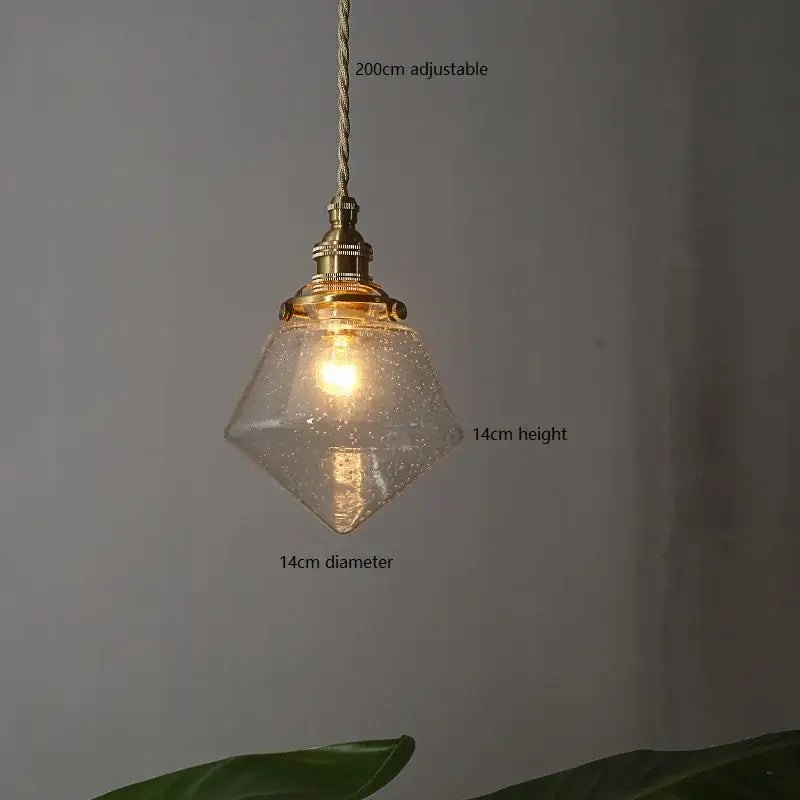 A warm diamond-shaped vintage brass glass led pendant light with adjustable 200cm cord for dining room use
