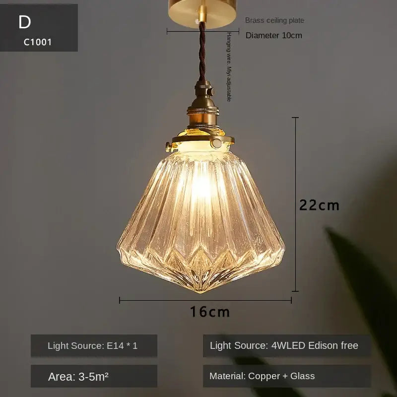 A warm-toned vintage brass glass led pendant light with faceted textured shade and metal top for dining room use