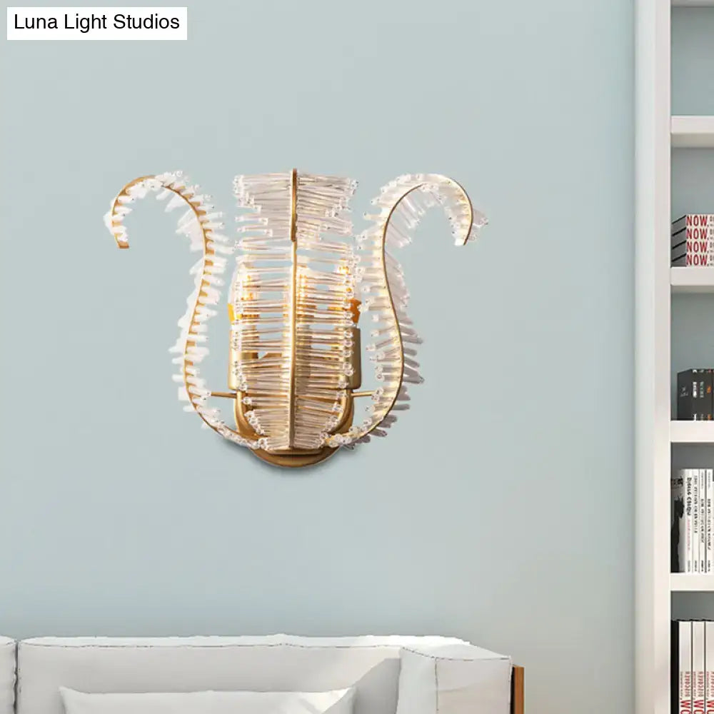 Vintage brass leaf glass wall sconce with gold-toned lyre design and crystal fringe for direct wired electric living room light fixture