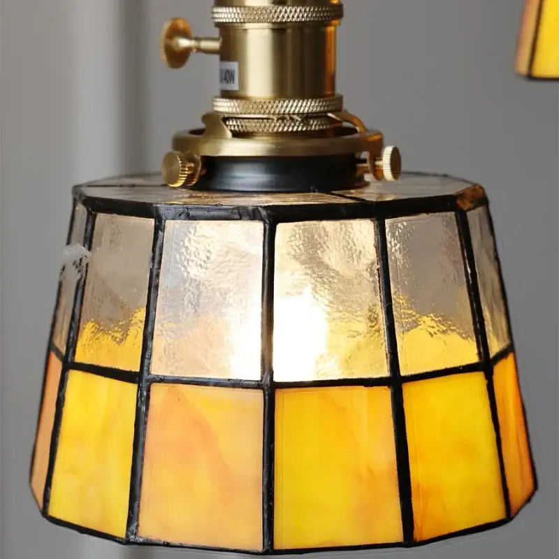 Vintage brass led pendant light featuring an amber glass stained lampshade with brass led pendant fixture decorbites