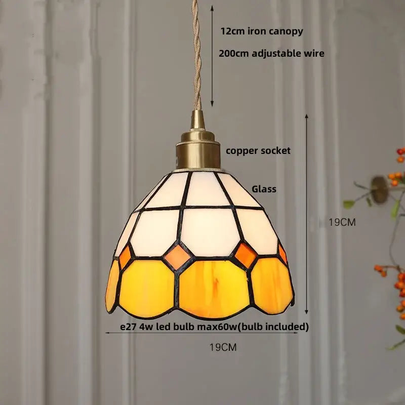 Vintage brass led pendant light featuring a warm amber glass honeycomb pattern with black lead lines for dining room decorbites brass led