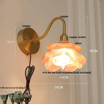 Vintage brass led wall light with warm-toned flower-shaped fluted glass shade and copper-finished arm for bedroom decorbites brass led wall