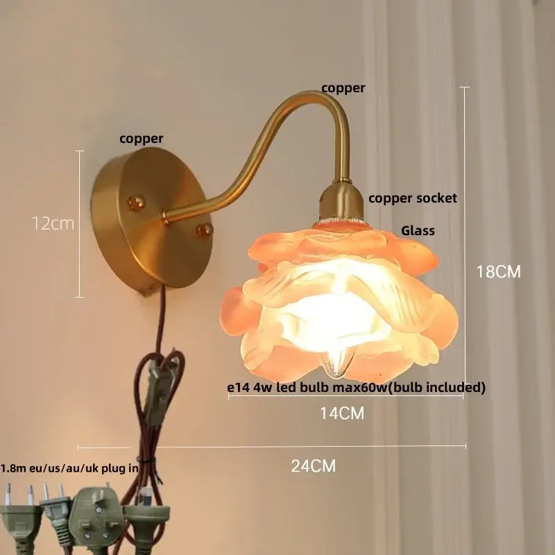 A warm-toned flower-shaped glass lamp with copper brass led wall sconce and decorbites brass led pull chain mount