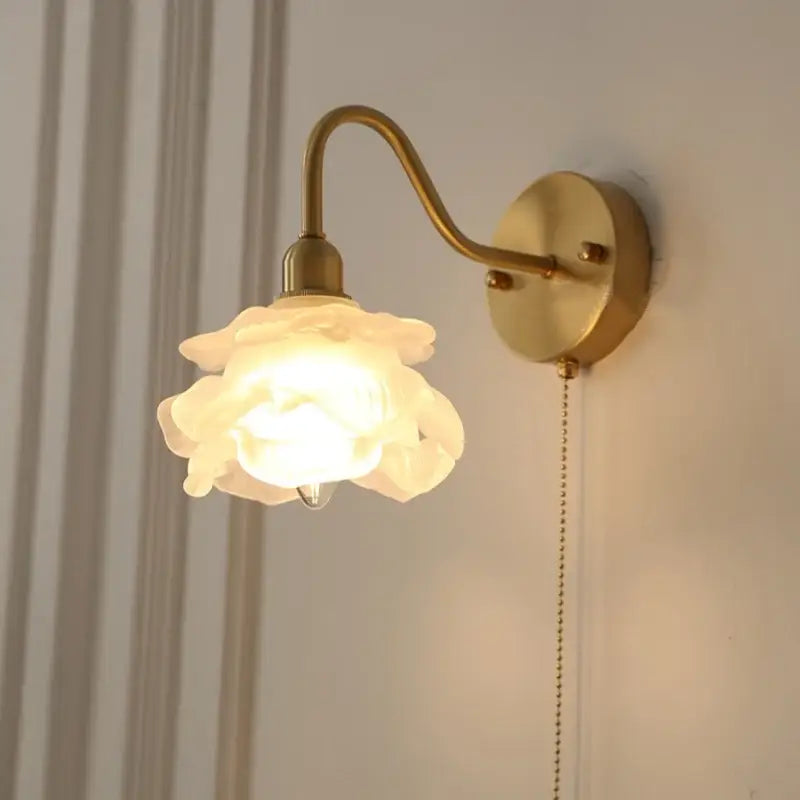 Vintage warm-toned brass led wall sconce with off-white ceramic rose lampshade and pull chain for bathroom vanity decorbites brass led wall