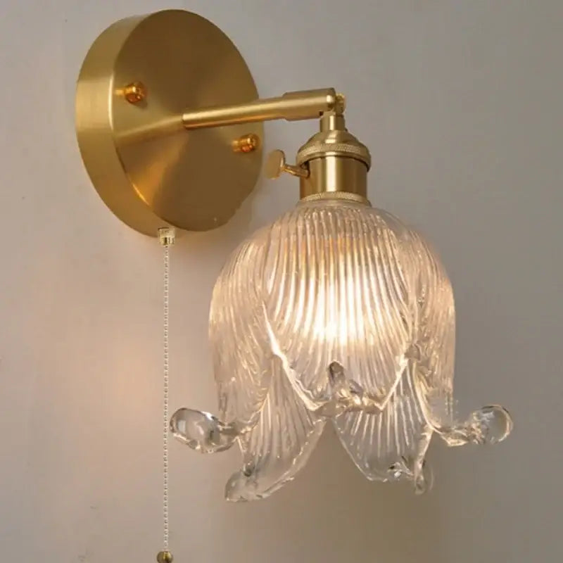 Gold-toned vintage brass loft amber glass wall light with clear ribbed flower-shaped shade for decorbites loft amber decor