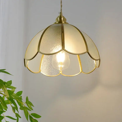 Vintage brass petal glass led pendant light with gold-toned frosted glass petals and warm ambient lighting for kitchen
