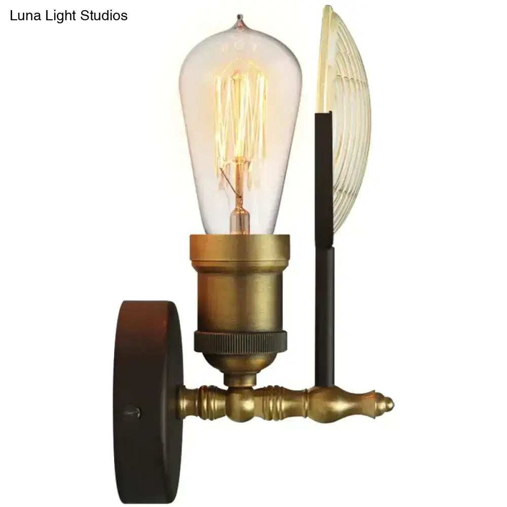 Vintage brass wall lamp sconce with ribbed glass led bulb and black decorative elements for bedroom lighting