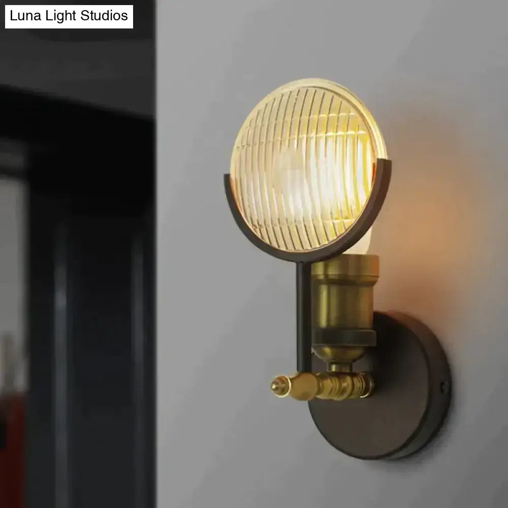 Vintage brass led wall lamp sconce with circular ribbed glass lens and metal components for bedroom lighting
