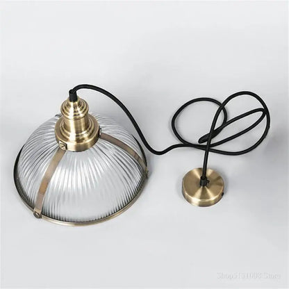 Vintage brass ribbed glass pendant light featuring clear glass pendant lights with brass accents for living room use