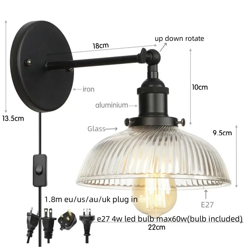 Vintage brass wall sconce with black iron and aluminum frame ribbed glass shade and pull chain switch for bedroom light