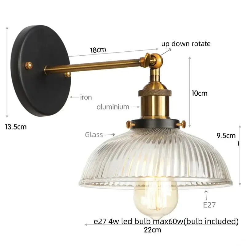 Vintage brass ribbed glass wall sconce with black iron backplate and pull chain switch for bedroom lighting