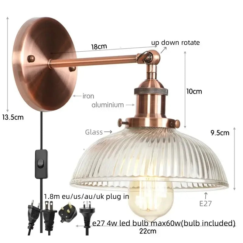 Copper-finished vintage brass wall sconce with ribbed glass shade and pull chain switch for bedroom lighting