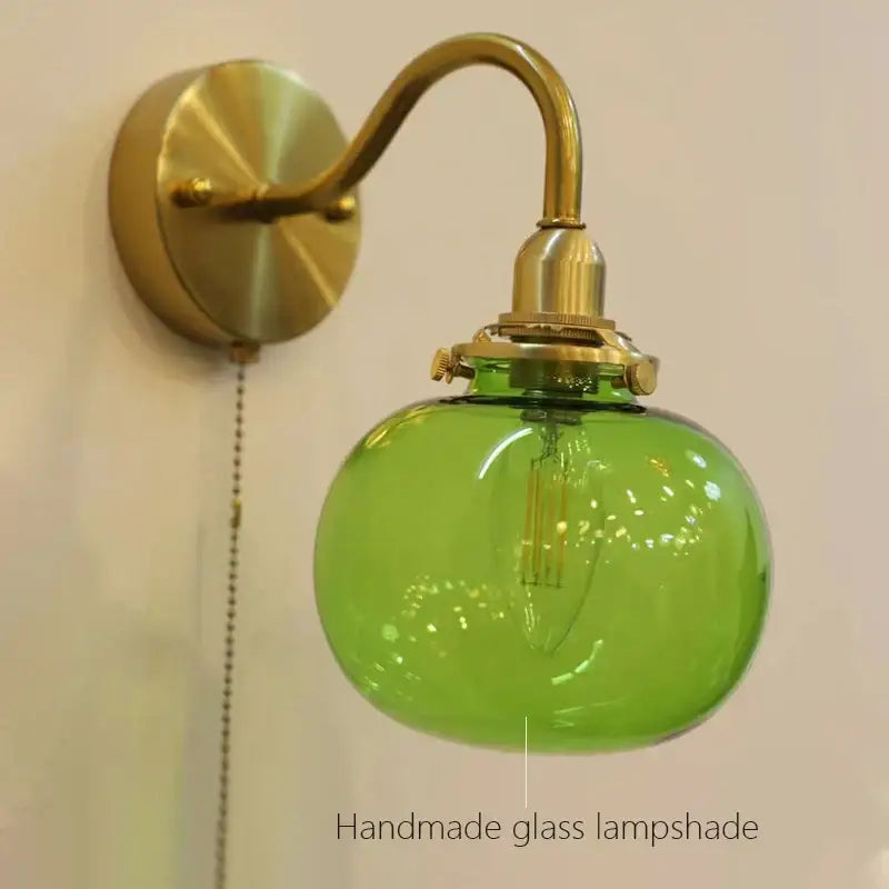 Vintage brass ribbed glass wall sconce lamp with emerald green shade and pull chain switch for bedroom lighting