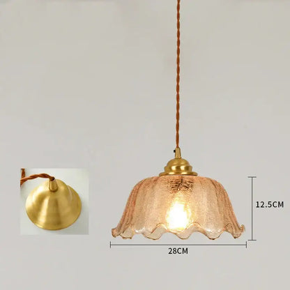 A warm-toned vintage brass scalloped glass led pendant lamp with textured glass and twisted cord for bedroom lighting