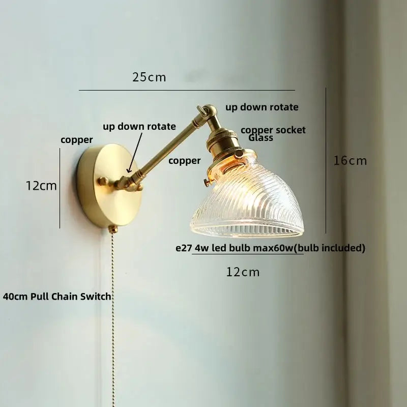 Vintage brass swing arm wall light fixture with ribbed glass shade and copper socket for bedroom use