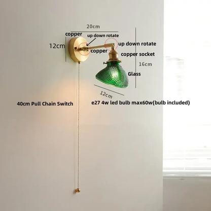 Vintage brass swing arm wall light fixture with green glass lamp copper finish and pull chain switch for bedroom use