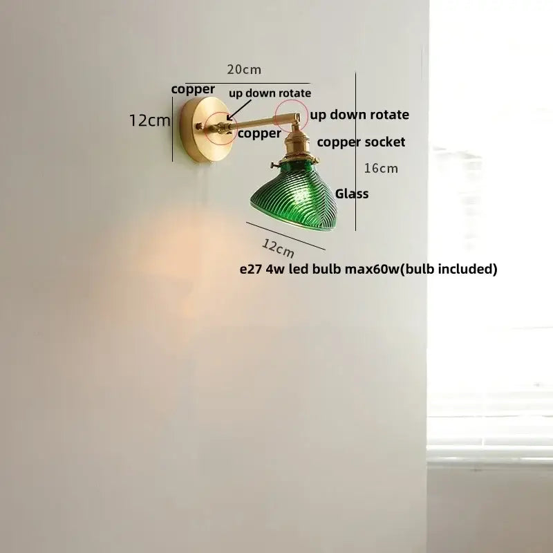 Vintage brass swing arm wall light fixture with green ribbed glass sconce and copper finish arms and socket