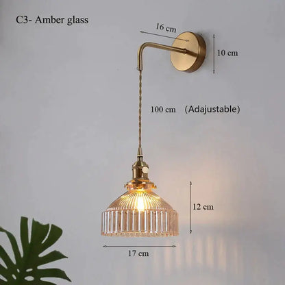 Vintage brass wall lamp with amber glass shade led and twisted cord for elegant living room lighting