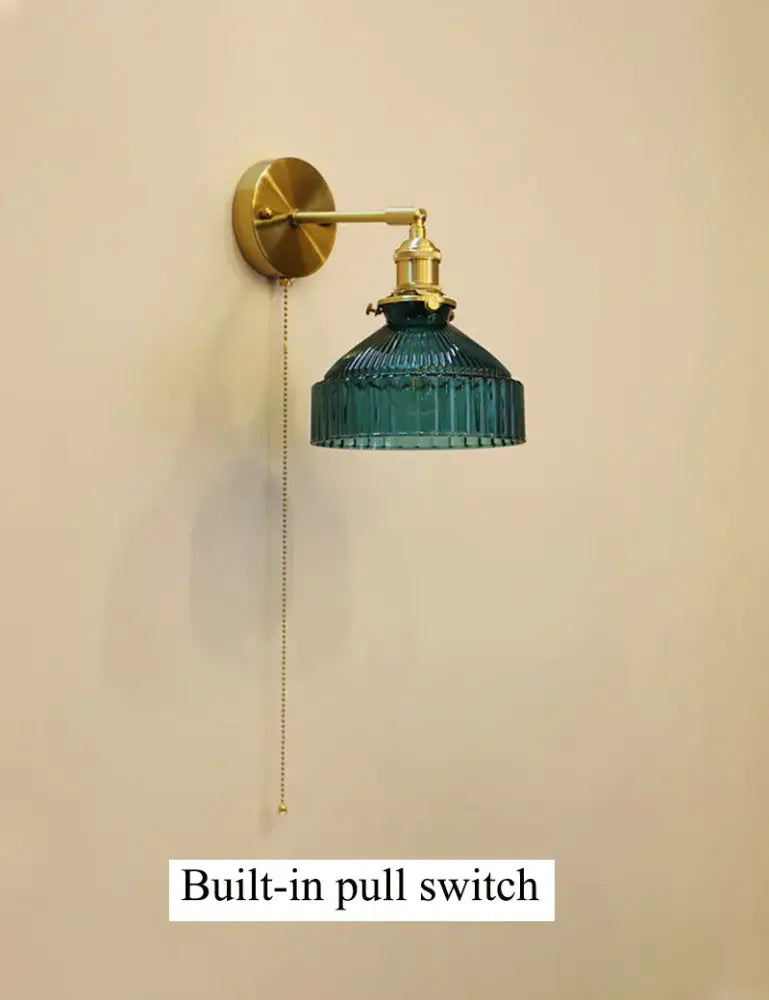 Vintage brass wall lamp with teal ribbed glass shade and built-in pull switch ideal for living room lighting with glass shade led compatibility