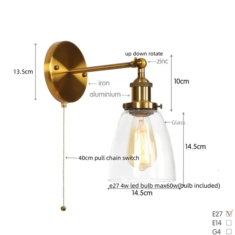 Vintage brass wall light fixture with a clear glass dome and exposed Edison bulb for bedroom lighting