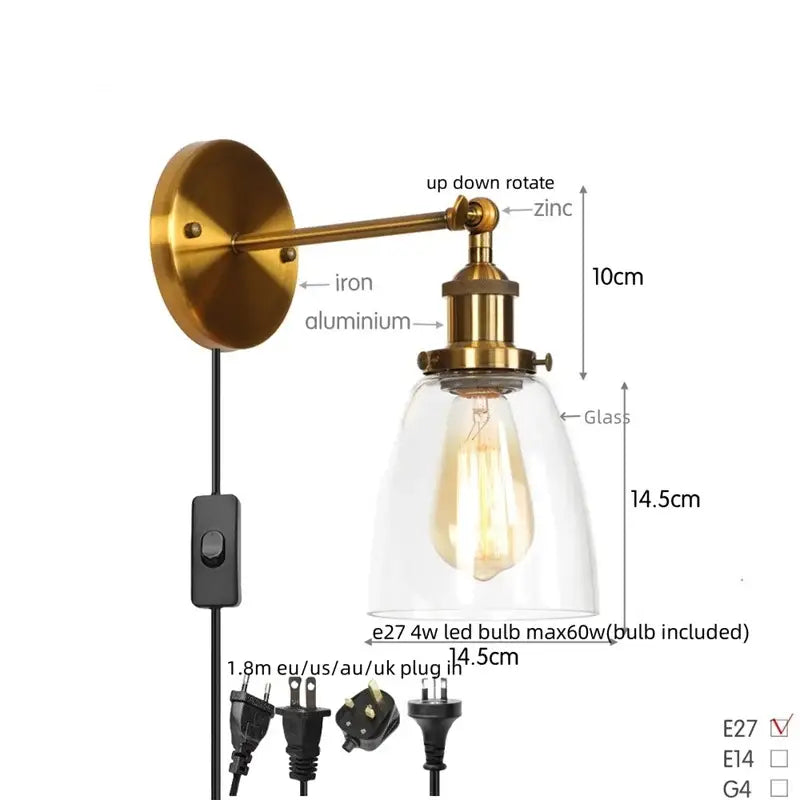 Vintage brass wall light fixture with clear glass dome and exposed edison-style bulb for bedroom lighting