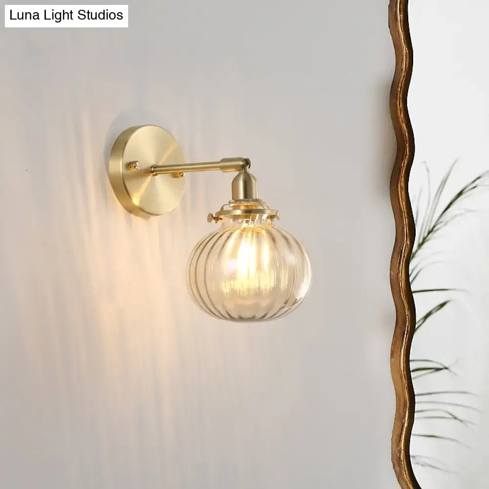 Vintage brass wall light with champagne clear ribbed glass shade and amber tinted globe for bedroom lighting