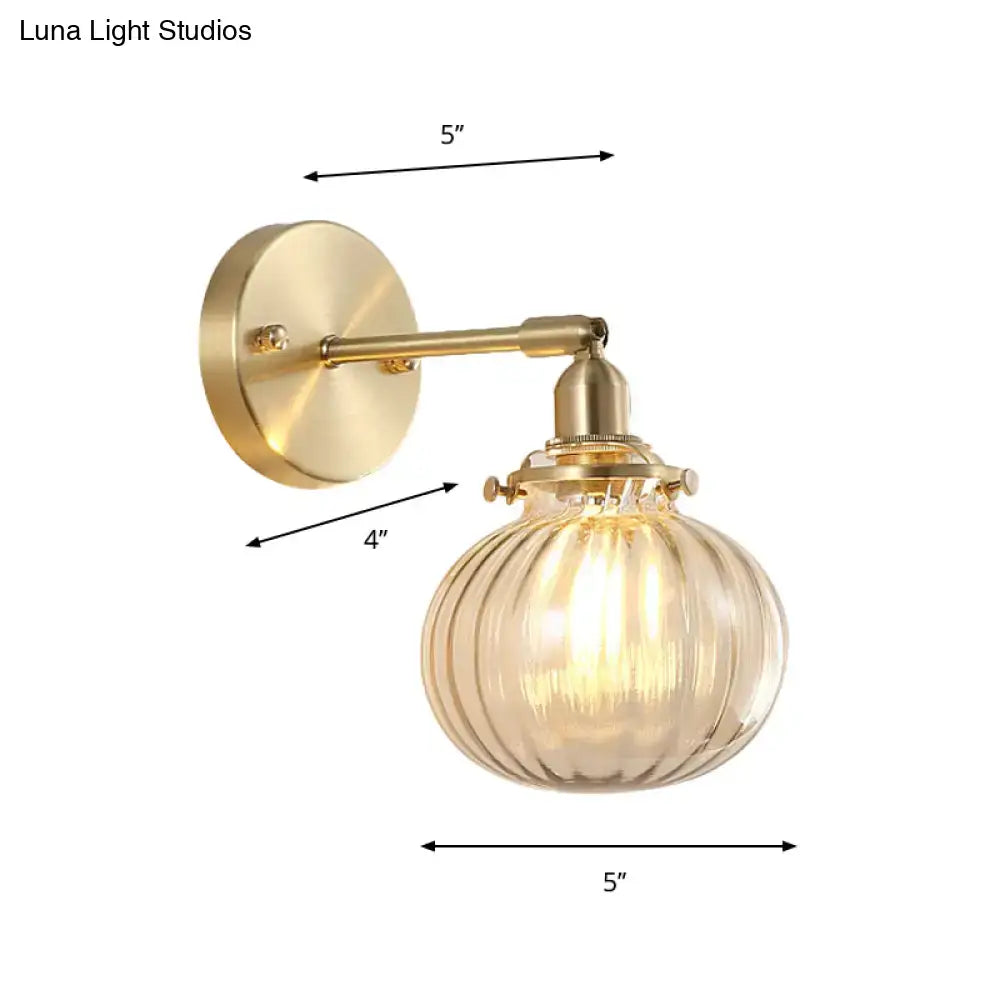 Vintage brass wall light with champagne clear ribbed glass shade and amber tint for bedroom use