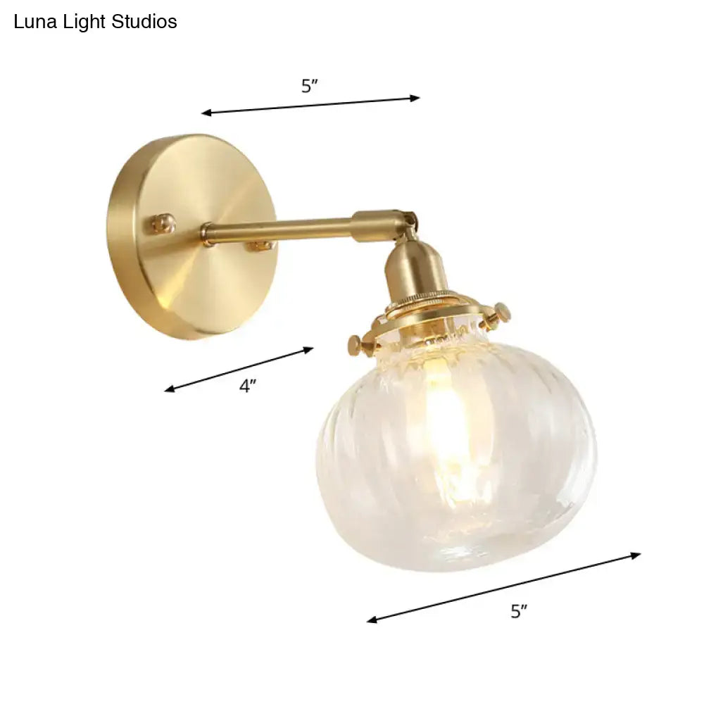 Vintage brass wall light with champagne clear textured glass shade for bedroom illumination