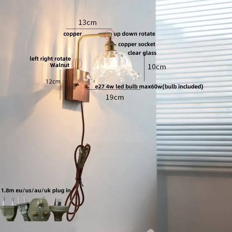 Vintage brass wall light with clear glass shade and copper sconce mounted on walnut-finished plate by decorbites clear glass