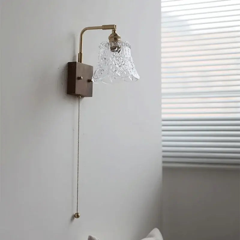 Vintage brass wall light featuring a clear glass etched floral shade by decorbites perfect for bedroom decor