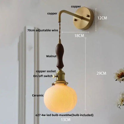 Vintage brass wall light with copper sconce, walnut handle, ribbed ceramic globe shade, knob switch, and decorbites ceramic knob