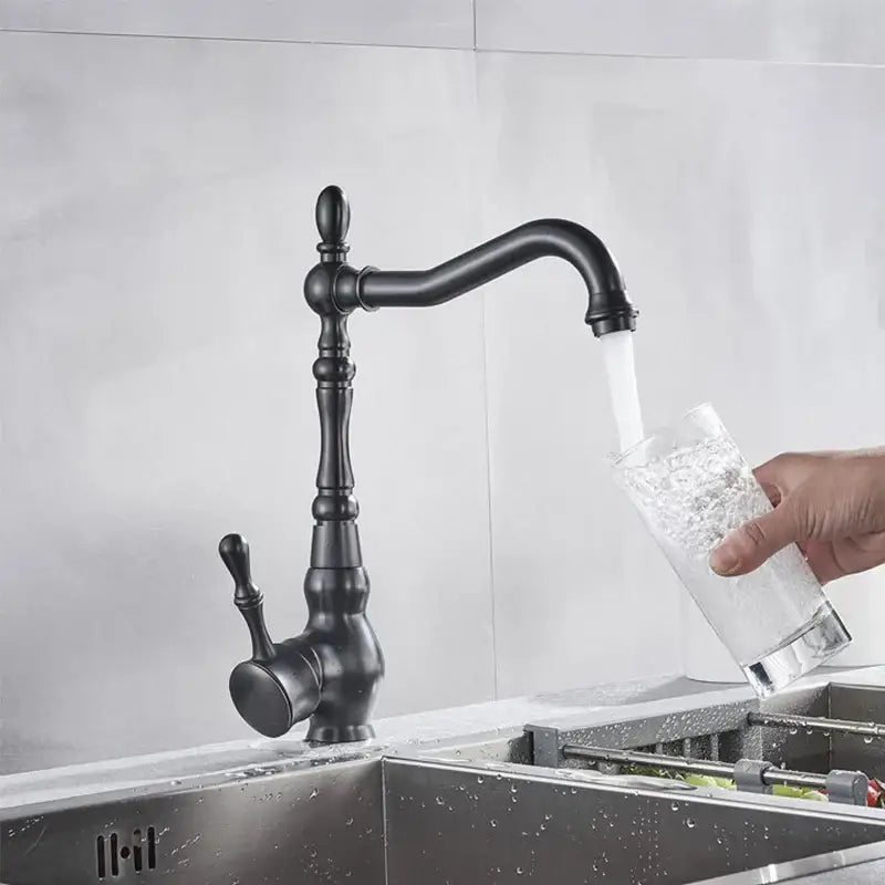 Black matte kitchen sink faucet with ornate detailing and curved spout decorbites bronze black kitchen design